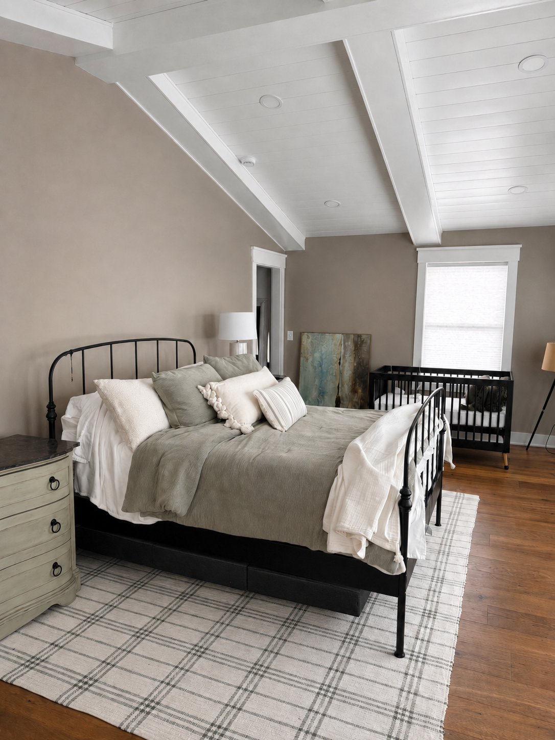 Finished bedroom with custom beam ceiling and trim